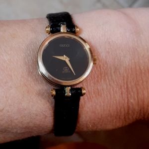 Vintage 80s Gucci Watch 14k Gold Bezel with black enamel accents